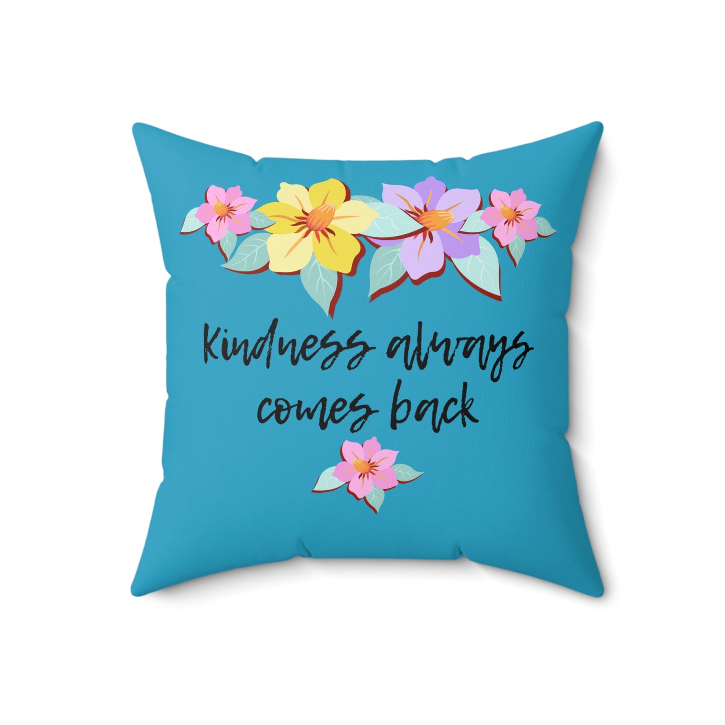 Almohada azul motivacional con motivo de flores y cita inspiradora "La bondad siempre vuelve"