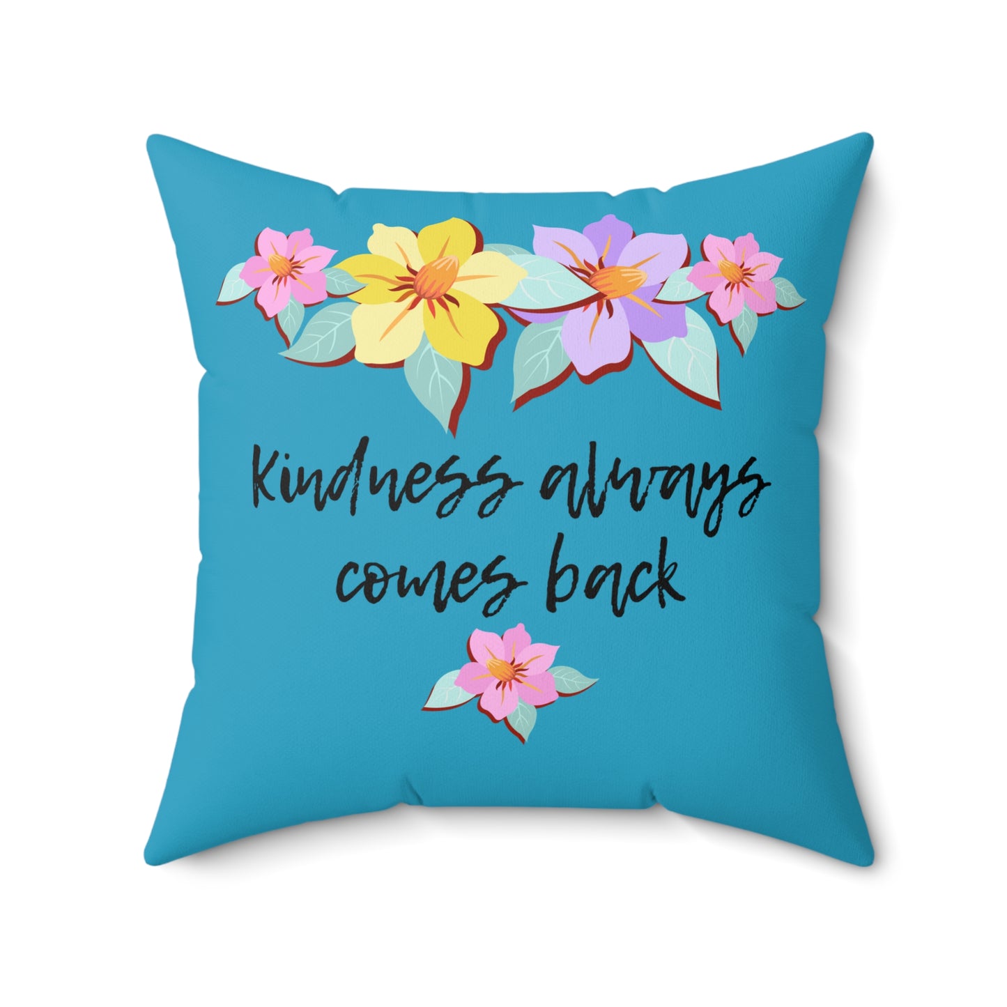 Almohada azul motivacional con motivo de flores y cita inspiradora "La bondad siempre vuelve"