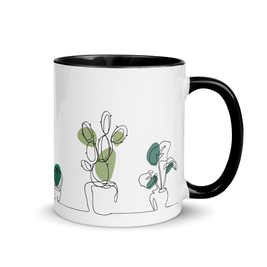 Taza de café con plantas y cactus del desierto