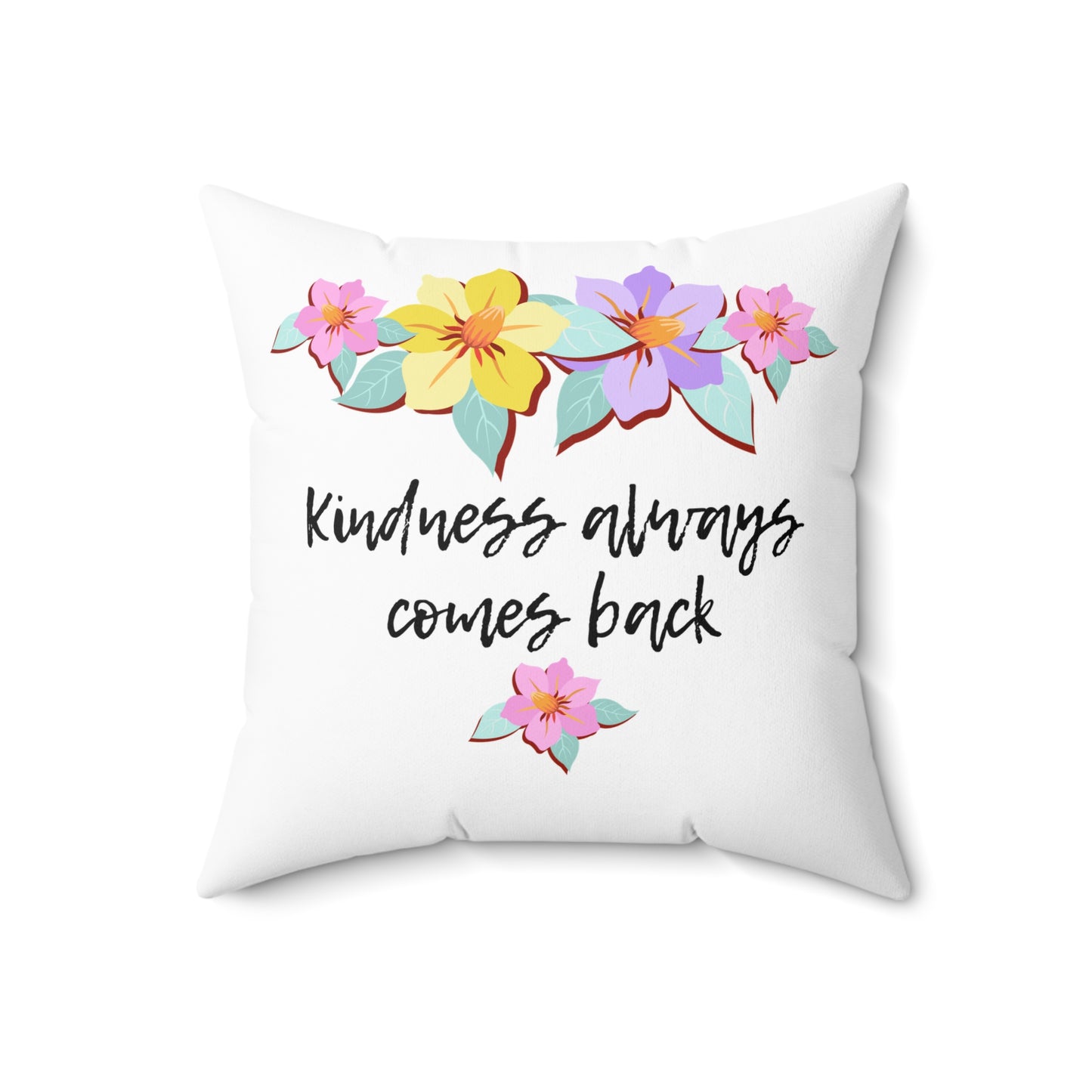 Almohada motivacional blanca con motivo de flores y cita inspiradora "La bondad siempre vuelve"