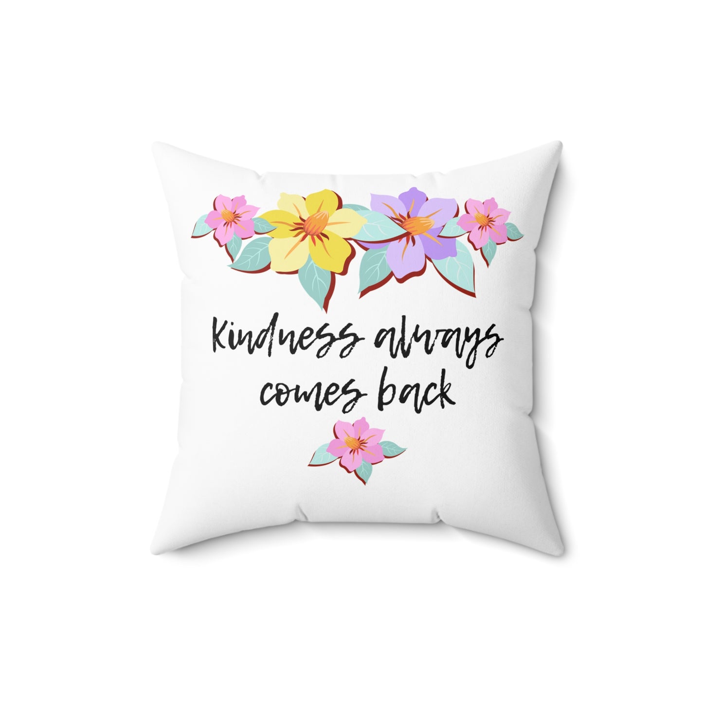 Almohada motivacional blanca con motivo de flores y cita inspiradora "La bondad siempre vuelve"